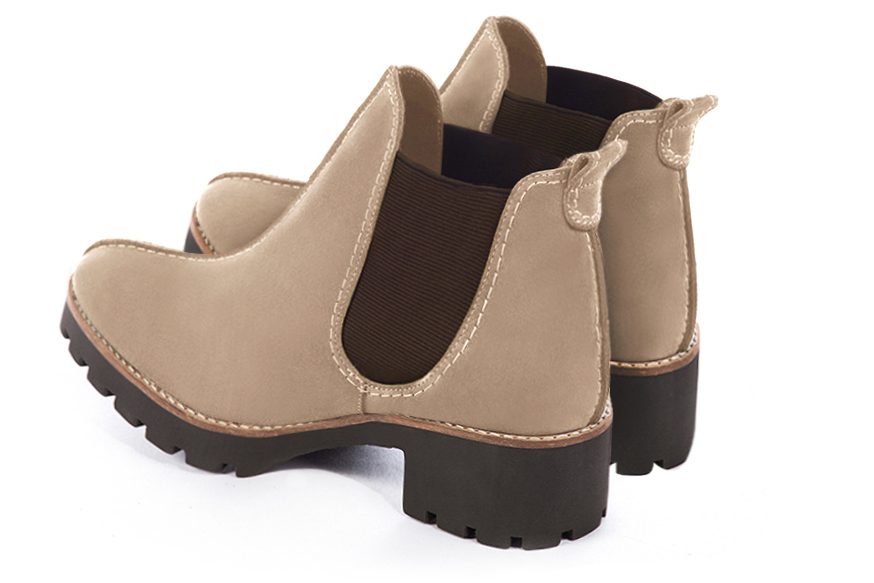 Tan beige and chocolate brown women's ankle boots, with elastics. Round toe. Low rubber soles. Rear view - Florence KOOIJMAN